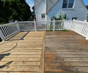 A residential wooden deck in Delaware County, PA that is half-stripped