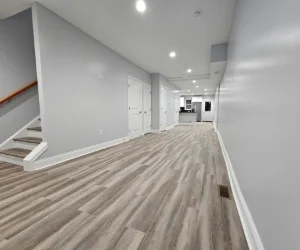 A residential living room in Delaware County, PA with new vinyl flooring installed