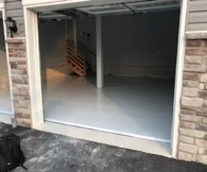 A residential garage in Delaware County, PA with a freshly painted gray floor