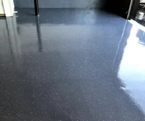 A residential garage in Delaware County, PA with a freshly painted gray floor