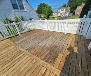 A residential deck in Delaware County, PA that is half pressure washed