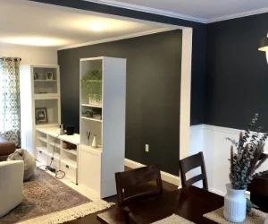 A residential living room after wallpaper removal services and painted black in Delaware County, PA