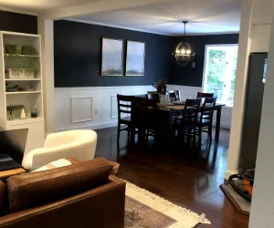 A residential living room after wallpaper removal services and painted black in Delaware County, PA